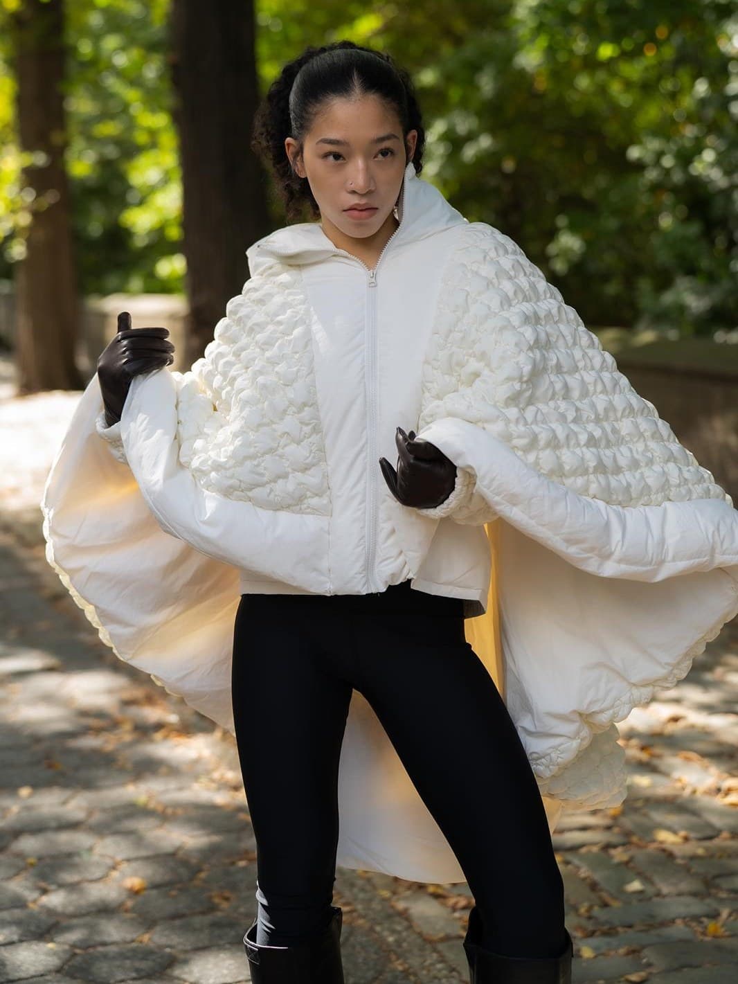 The Phoenix Cape, sculptural white outerwear, photographed on location